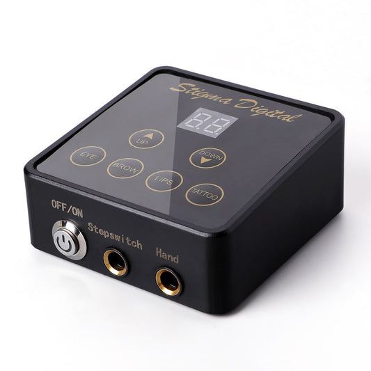 STIGMA Digital Display Tattoo Rotary Machine Power Supply. Black square unit with a digital display and function buttons like 'EYE', 'BROW', 'LIPS', 'TATTOO' on top.