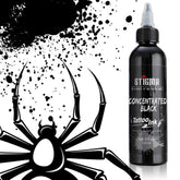 Stigma Concentrated Black Tattoo Ink bottle (120ml) with a black spider and ink splatters in the background.