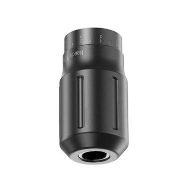 A black grip for a CNC X-WE wireless tattoo machine with a ruler scale on the surface.